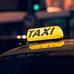 yellow taxi cab on road during night time