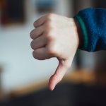 person in blue long sleeve shirt showing right hand